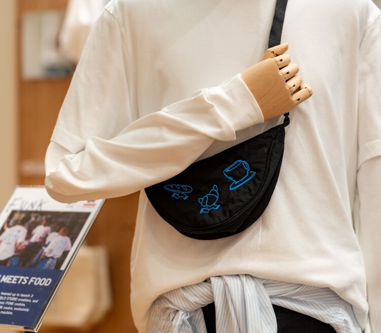Close-up photo of a mannequin wearing a white sweatshirt