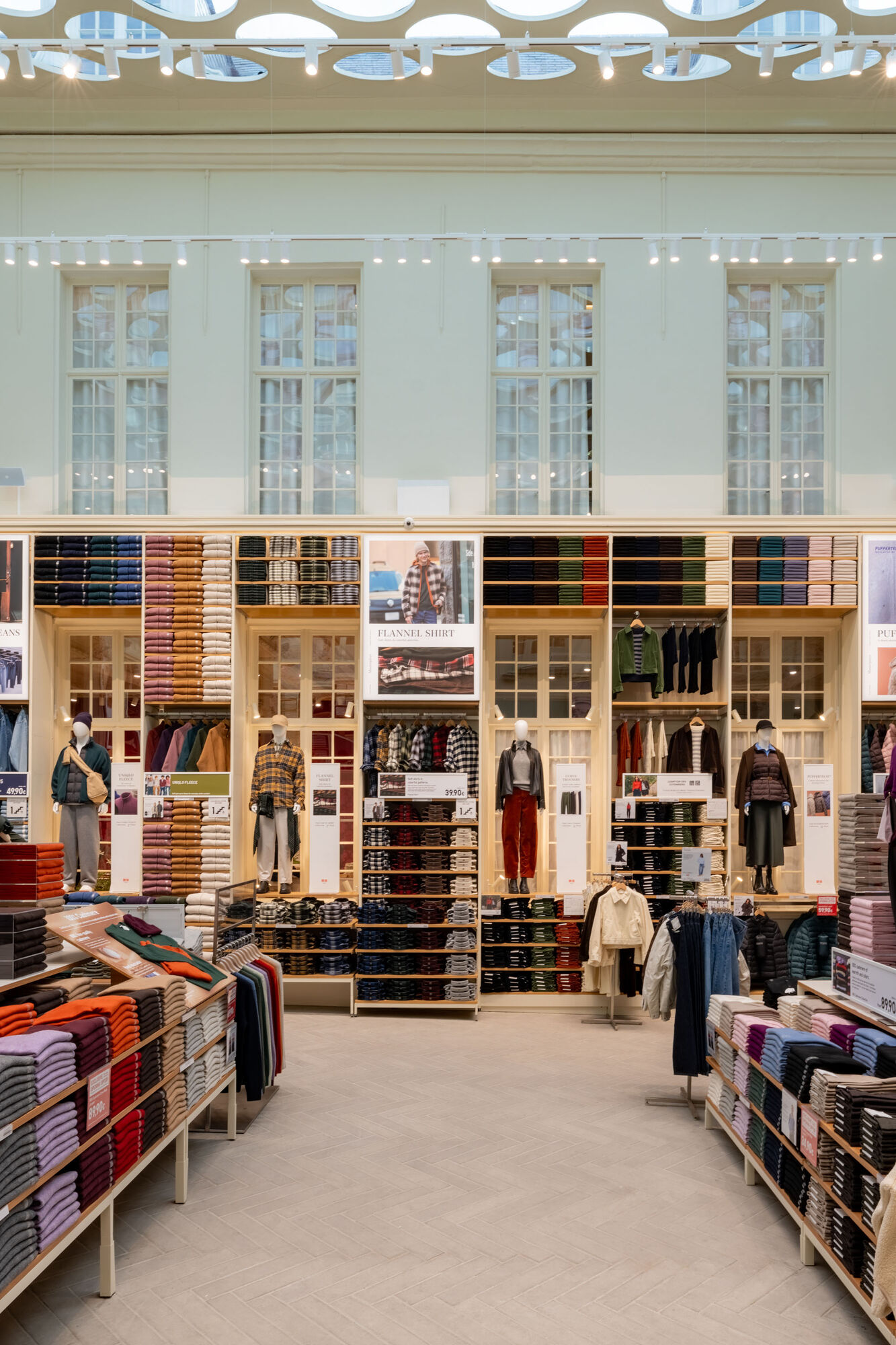 Photo showing four mannequins displayed on top of a shelf