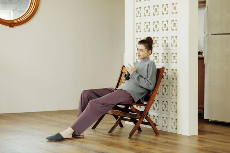 Woman wearing a satin drape straight leg trousers