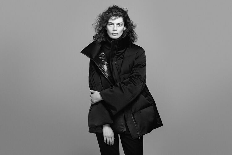 Woman wearing a +J volume down jacket