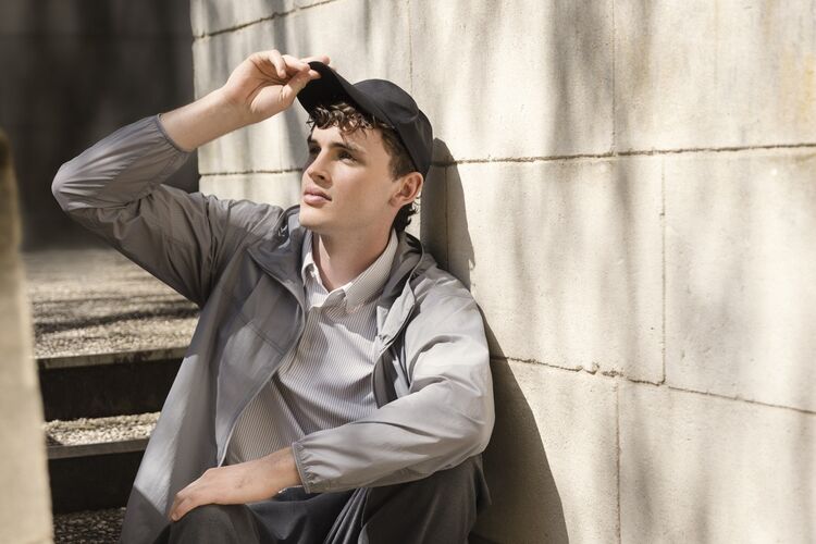 Male model wearing UV protection hooded jacket and a patterned shirt