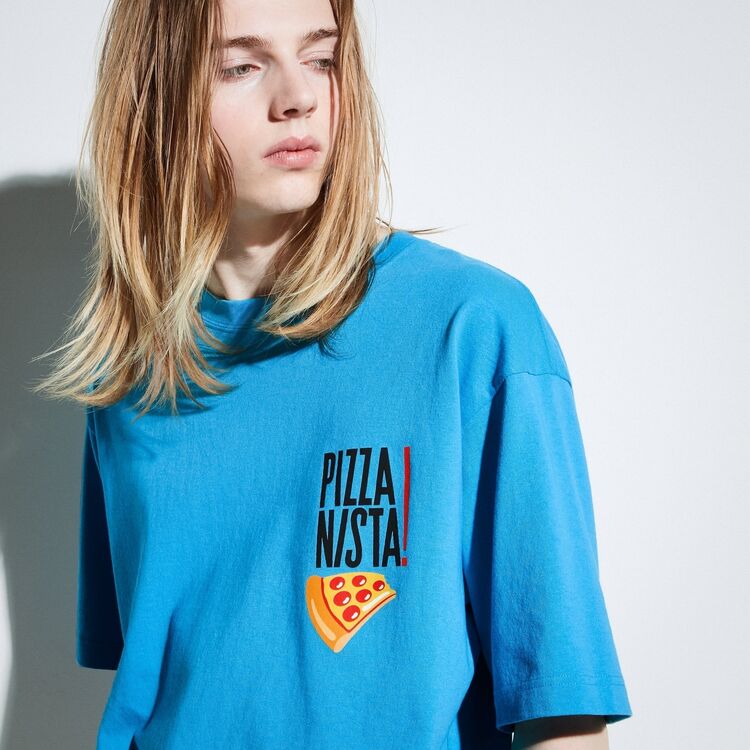 model wearing blue graphic T-shirt