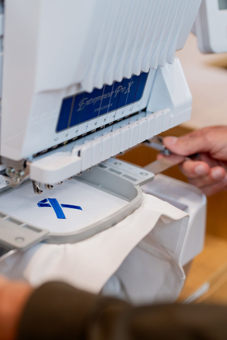 design being added by embroidery machine