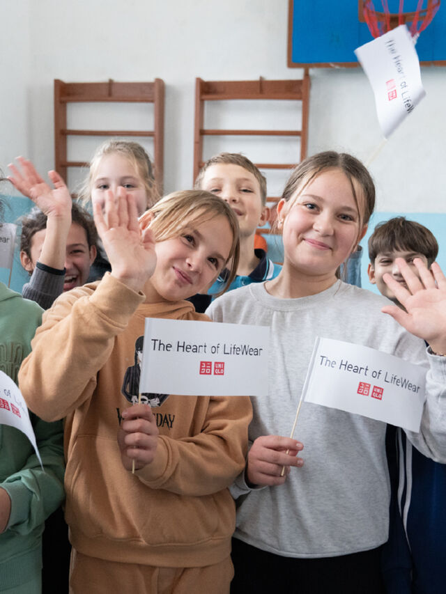 children holding heart of lifewear flags