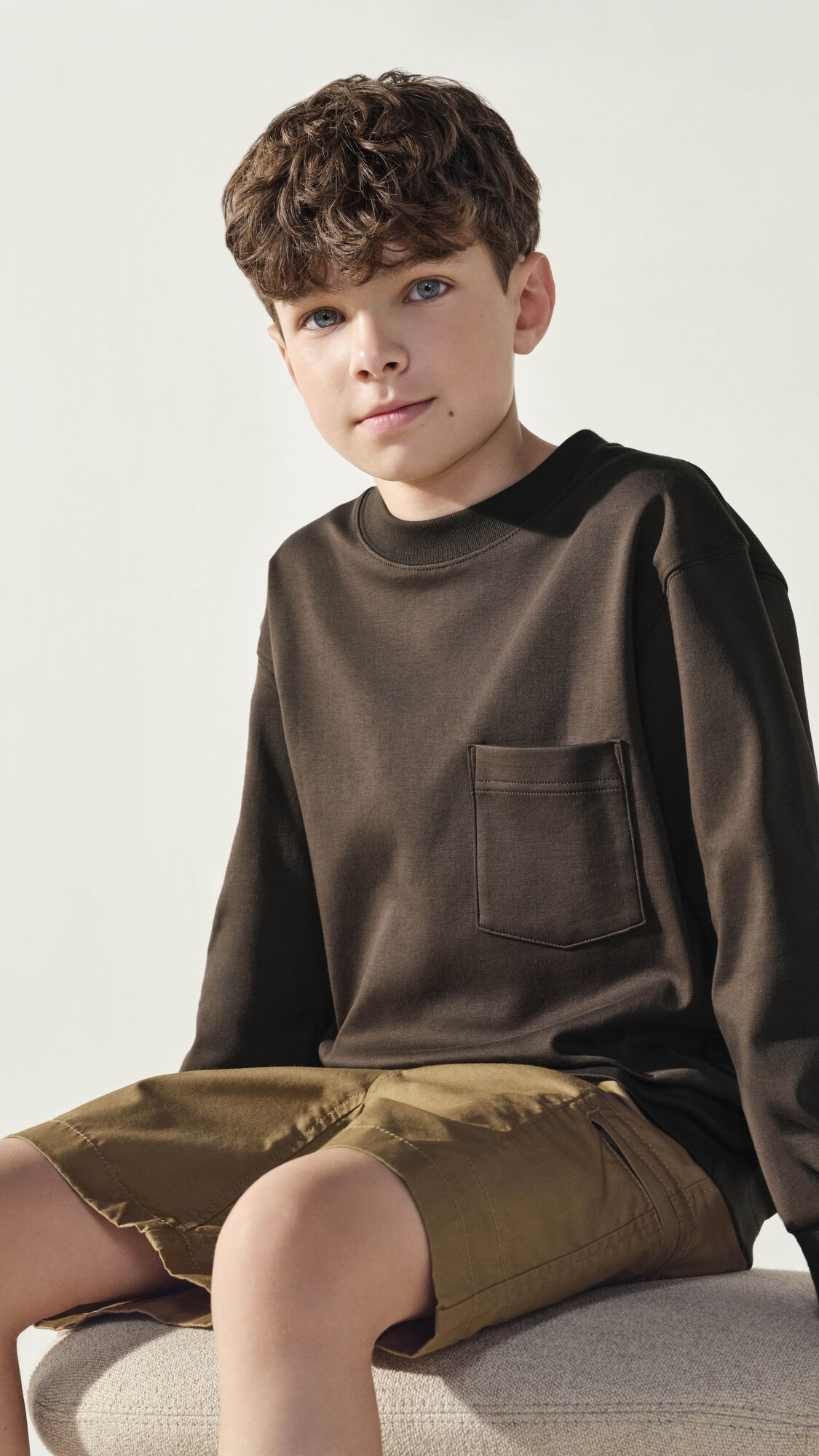 kid wearing Uniqlo U T-shirt