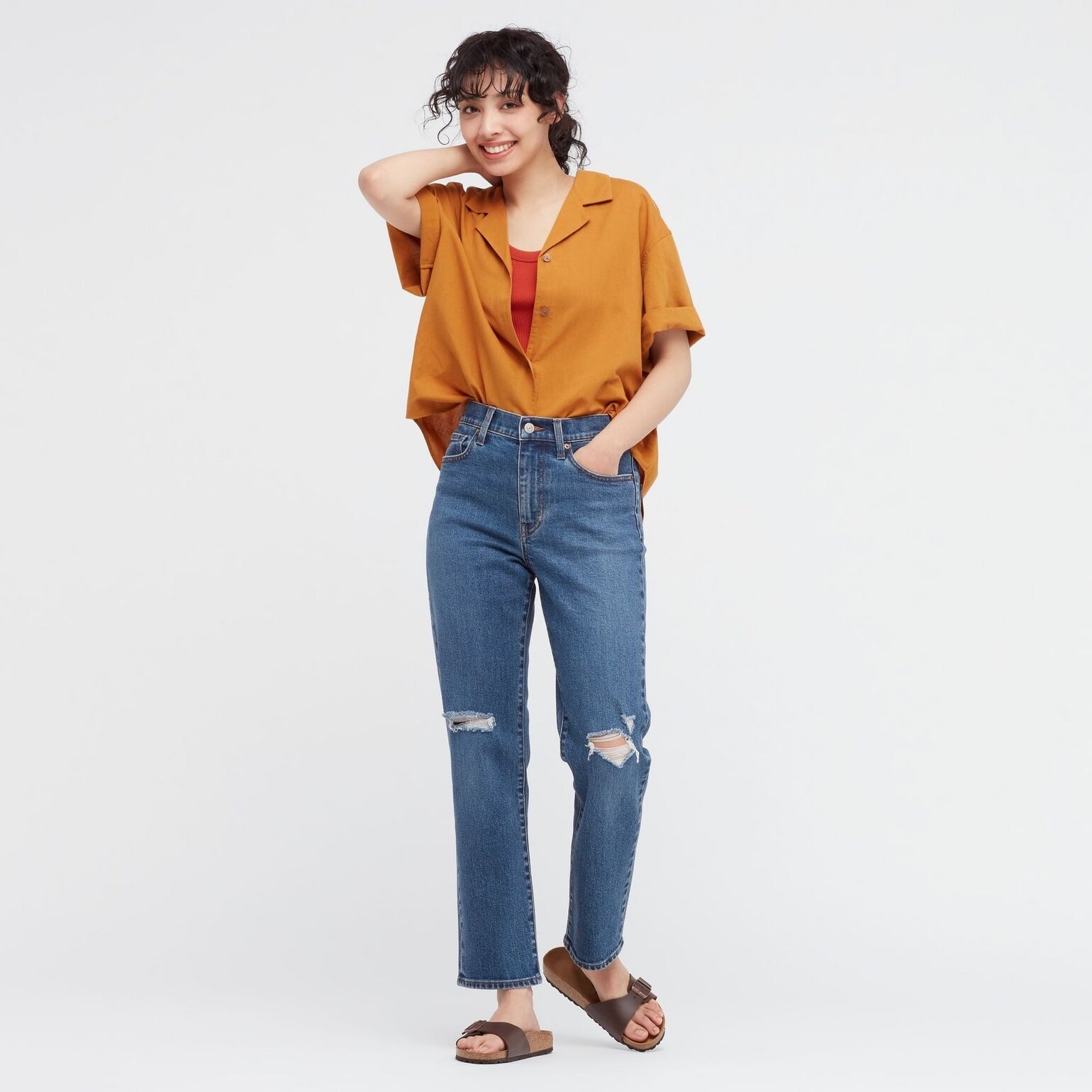 woman wearing UNIQLO ripped jeans, linen shirt and ribbed tank top