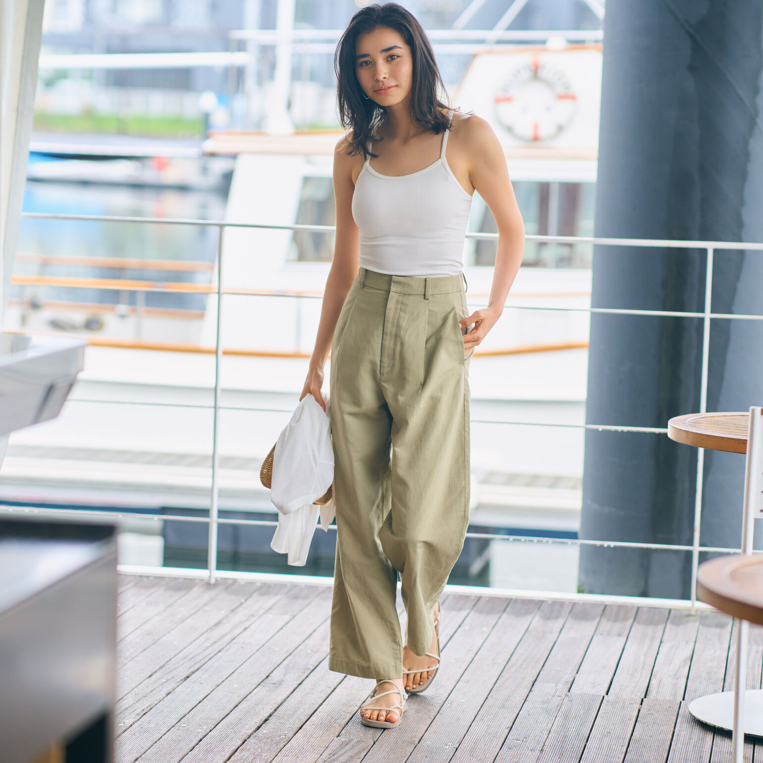 woman wearing UNIQLO cropped camisole bratop