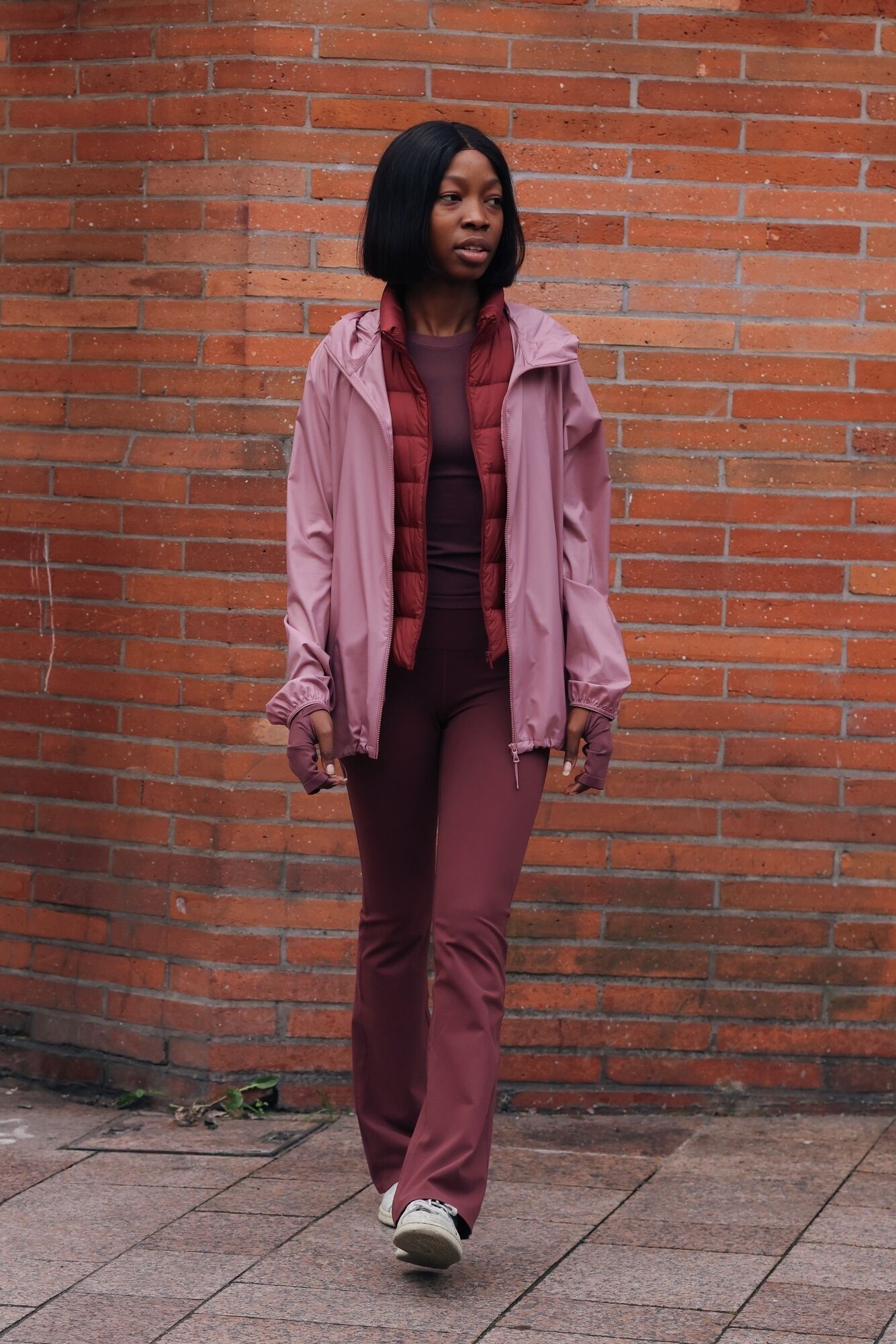 model wearing UNIQLO AIRism T-shirt and leggings, Ultra Light Down gilet, and parka