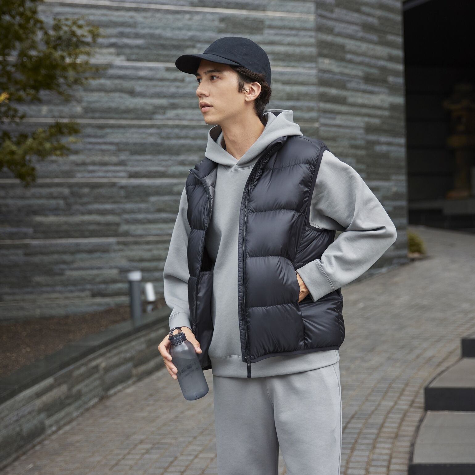 model wearing UNIQLO DRY hoodie, T-shirt, and Ultra Light Down gilet
