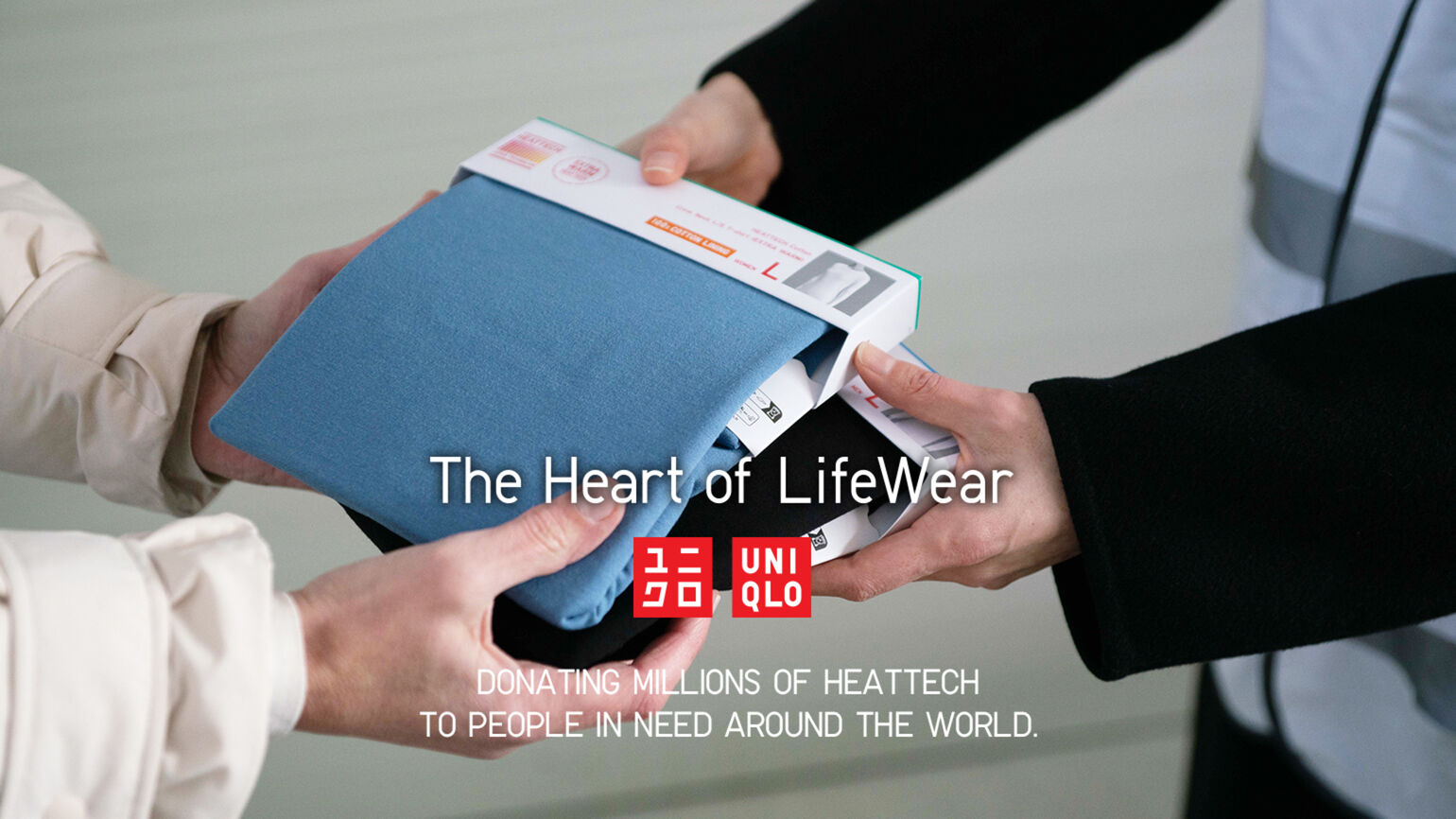 HEATTECH clothing being handed from one person to another