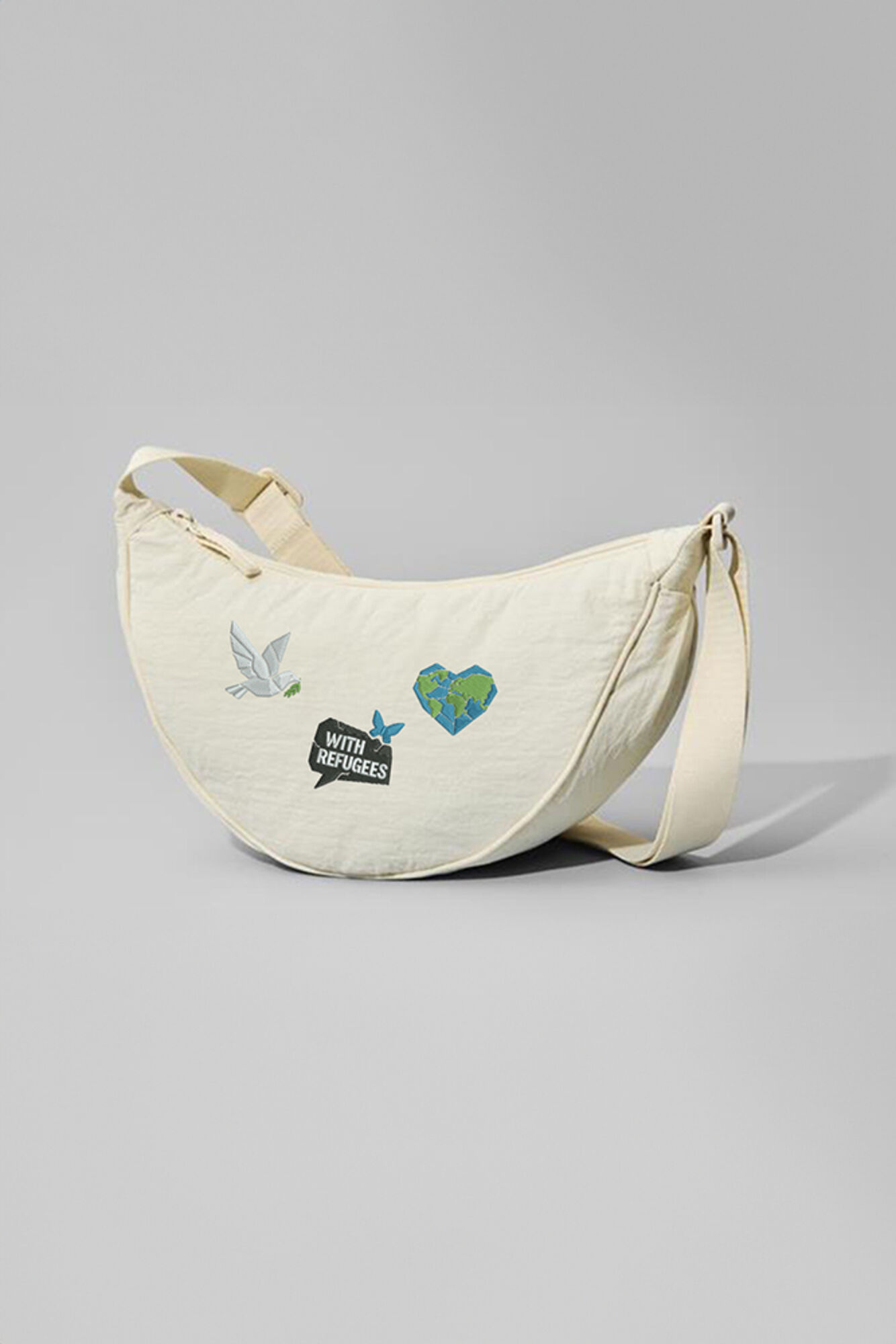 UNIQLO Round Mini Shoulder Bag featuring embroidery for World Refugee Day