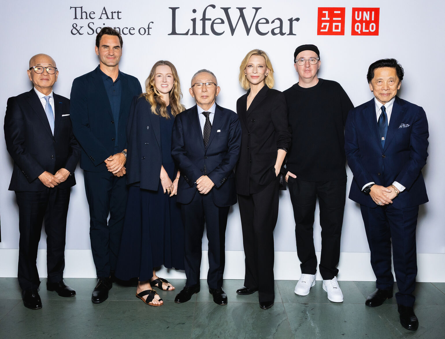 representatives from UNIQLO against a backdrop that reads 'The art and science of lifewear'