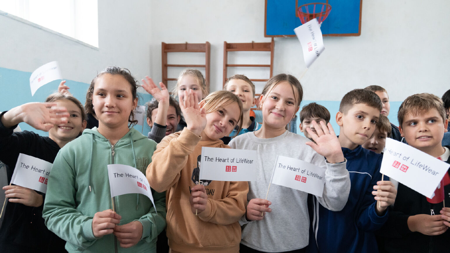 children holding heart of lifewear flags
