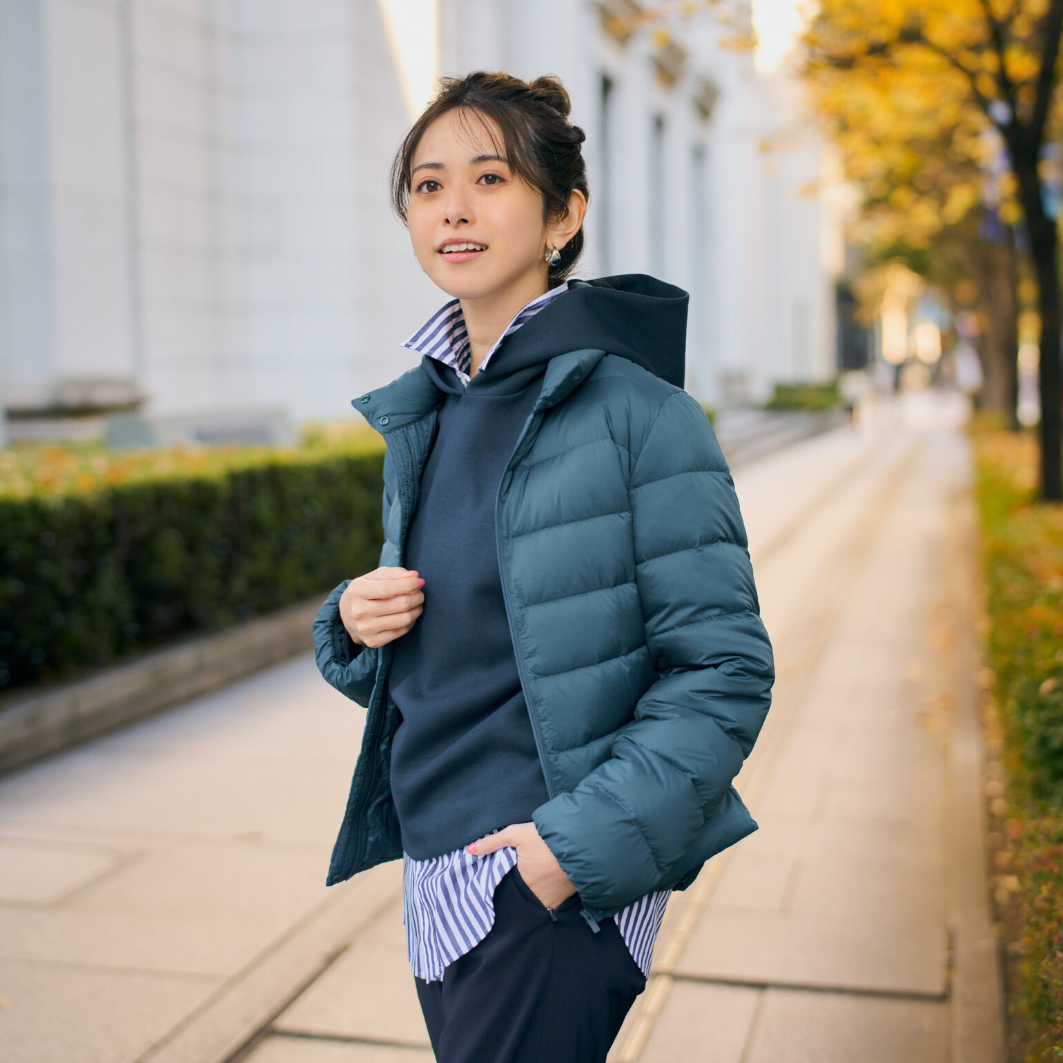 model wearing UNIQLO hoodie, HEATTECH trousers, Ultra Light Down jacket, and shirt