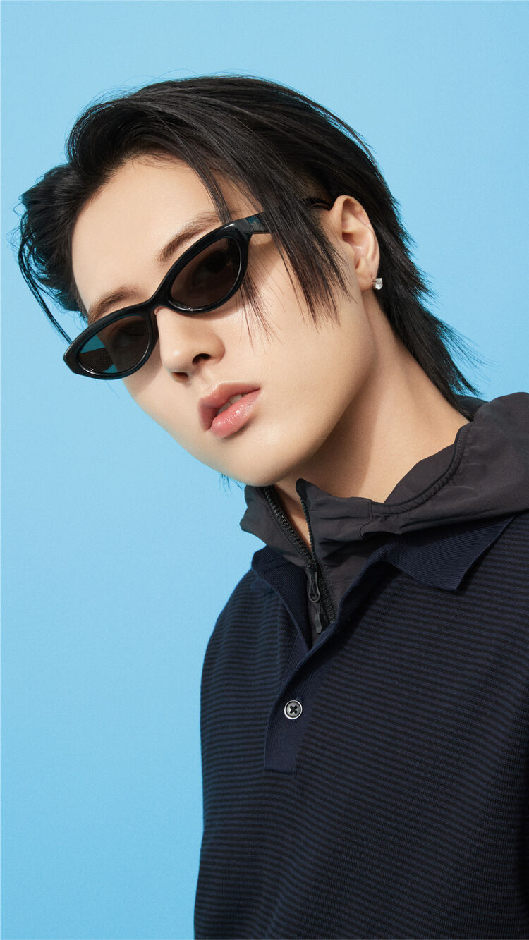 A close-up image emphasizing HARUTOs features as he gazes forward with a sharp look while wearing stylish Narrow Sunglasses.