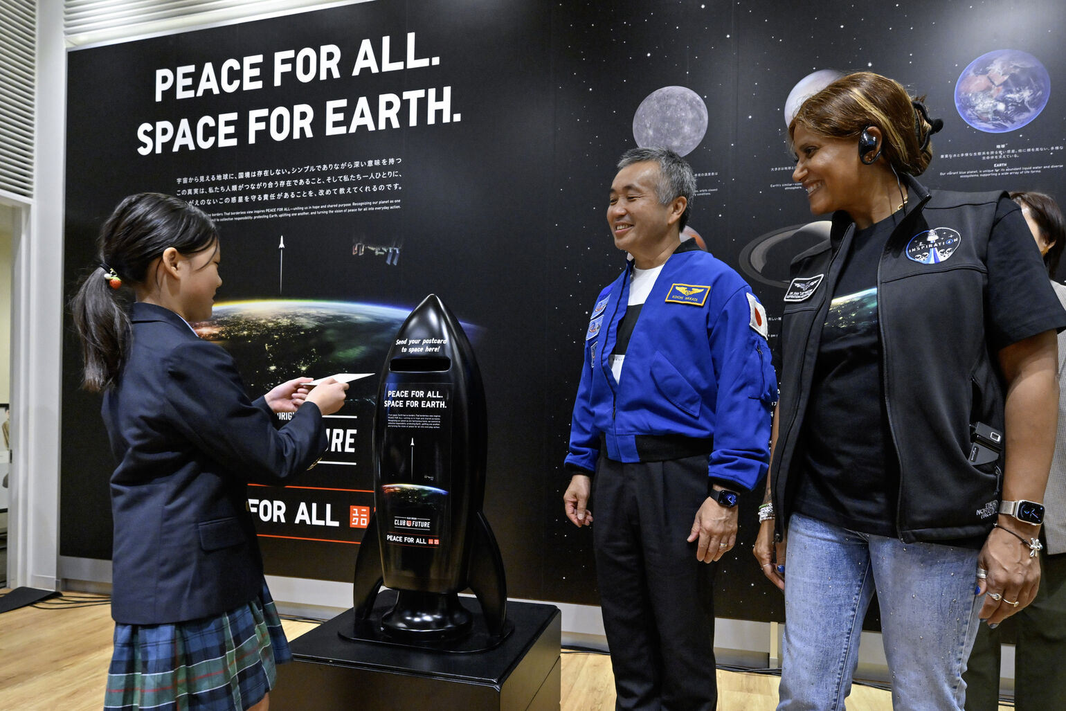 Postcards being posted in a designated postbox at the venue