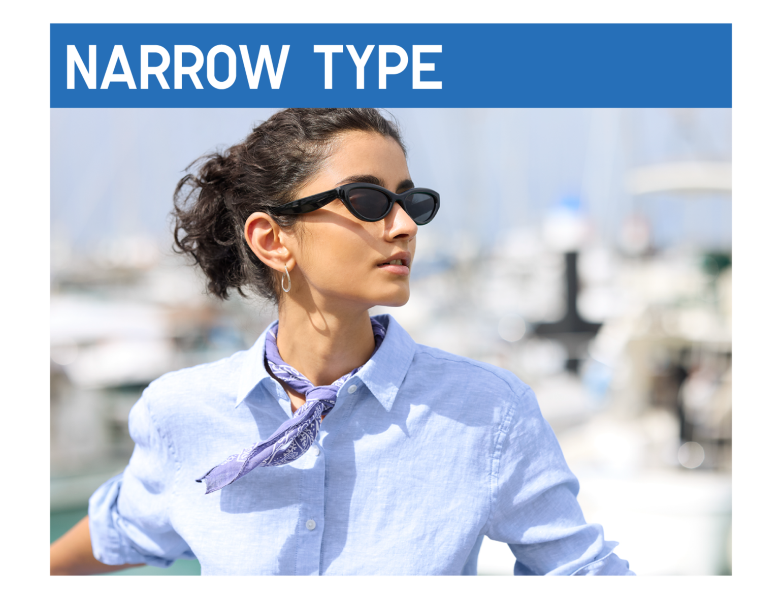 An image of a woman looking to the side against the backdrop of a marina, wearing narrow-type black sunglasses, a blue shirt, and a bandana, under a blue