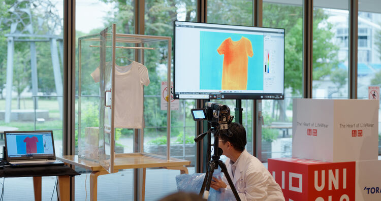 An image of someone holding a camera at an event.