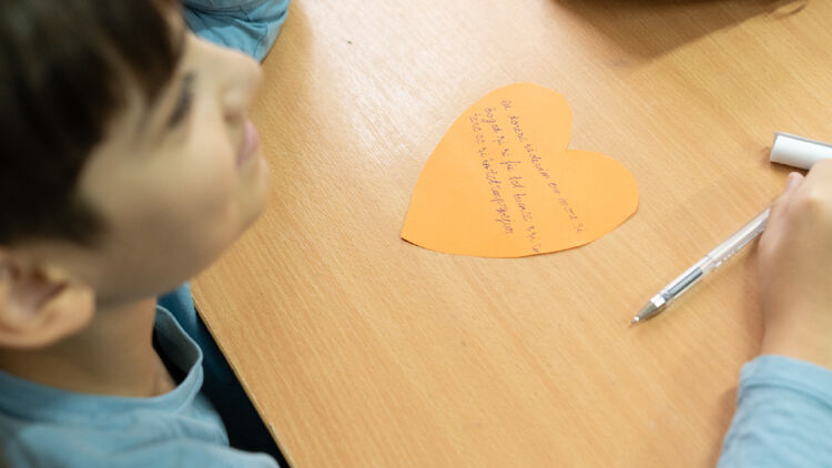 Image of heart-shaped message cards with handwritten messages