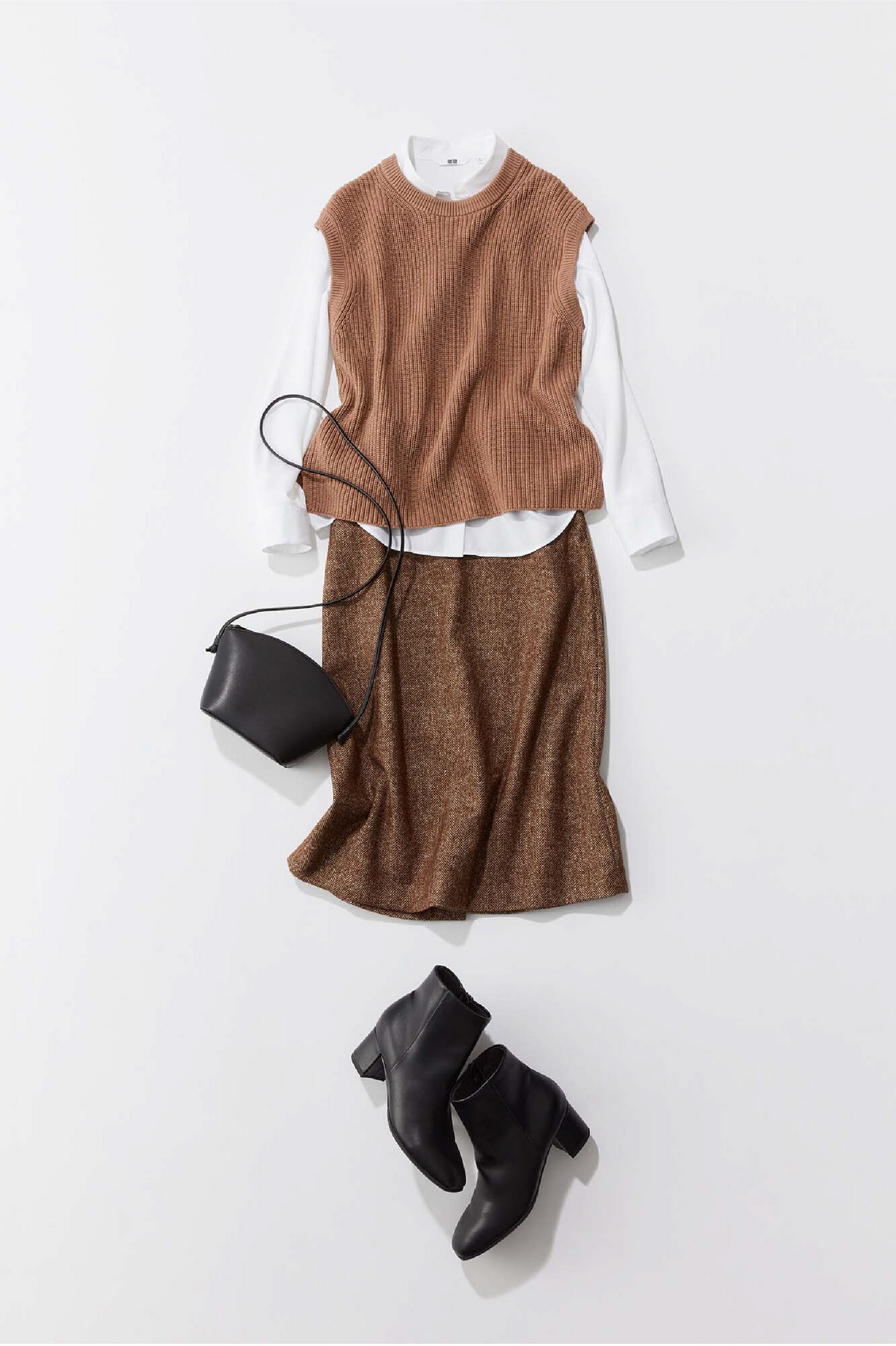 ベージュのサイドスリットベストと白いレーヨンブラウスと茶色のウールブレンドナローミディスカートを使ったコーディネート