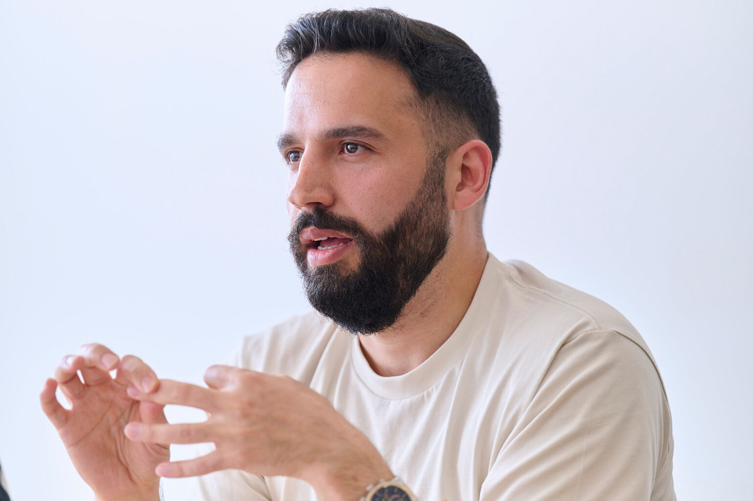 Close-up photo of Husam Kattan being interviewed.