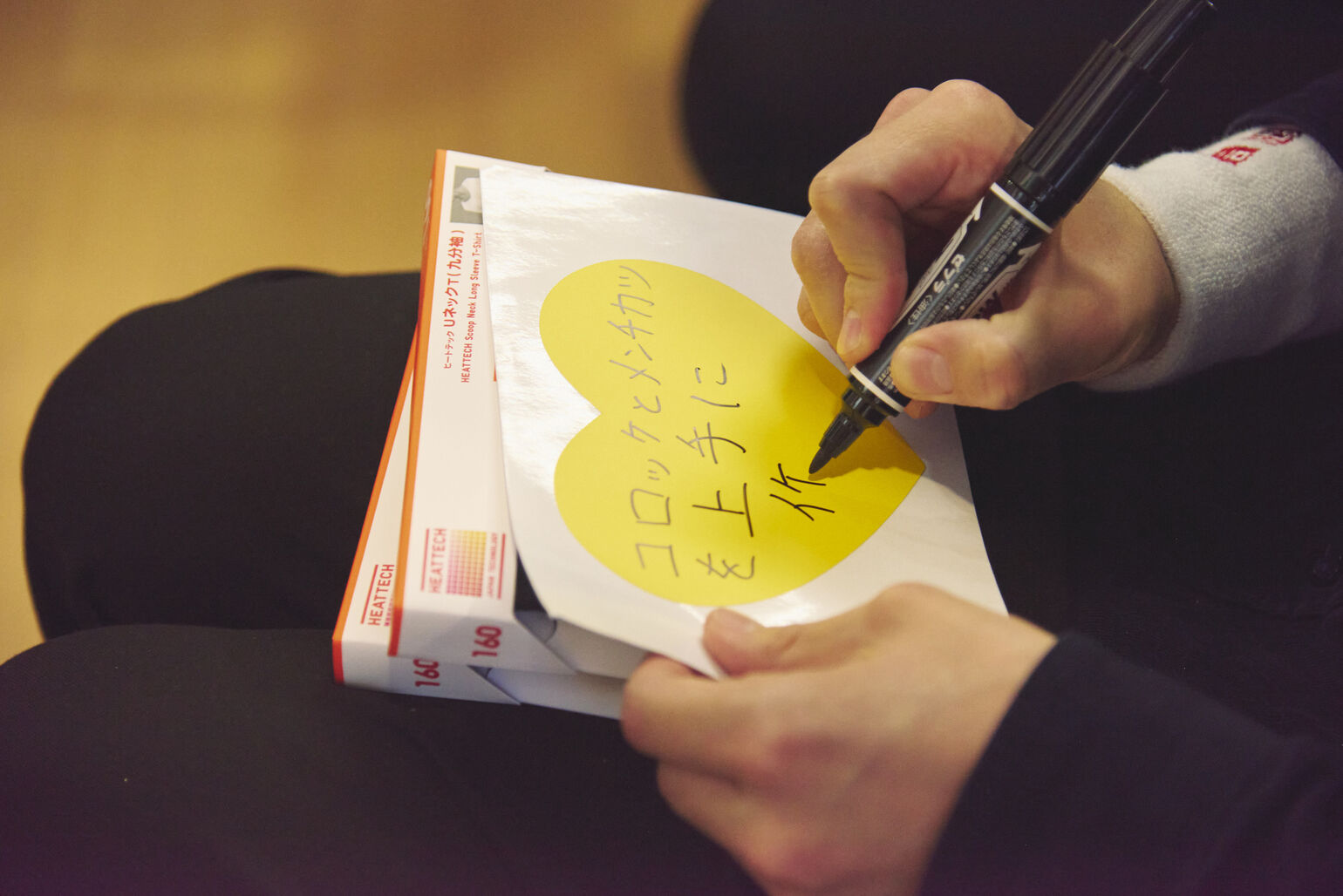 A close-up image of a hand writing 
