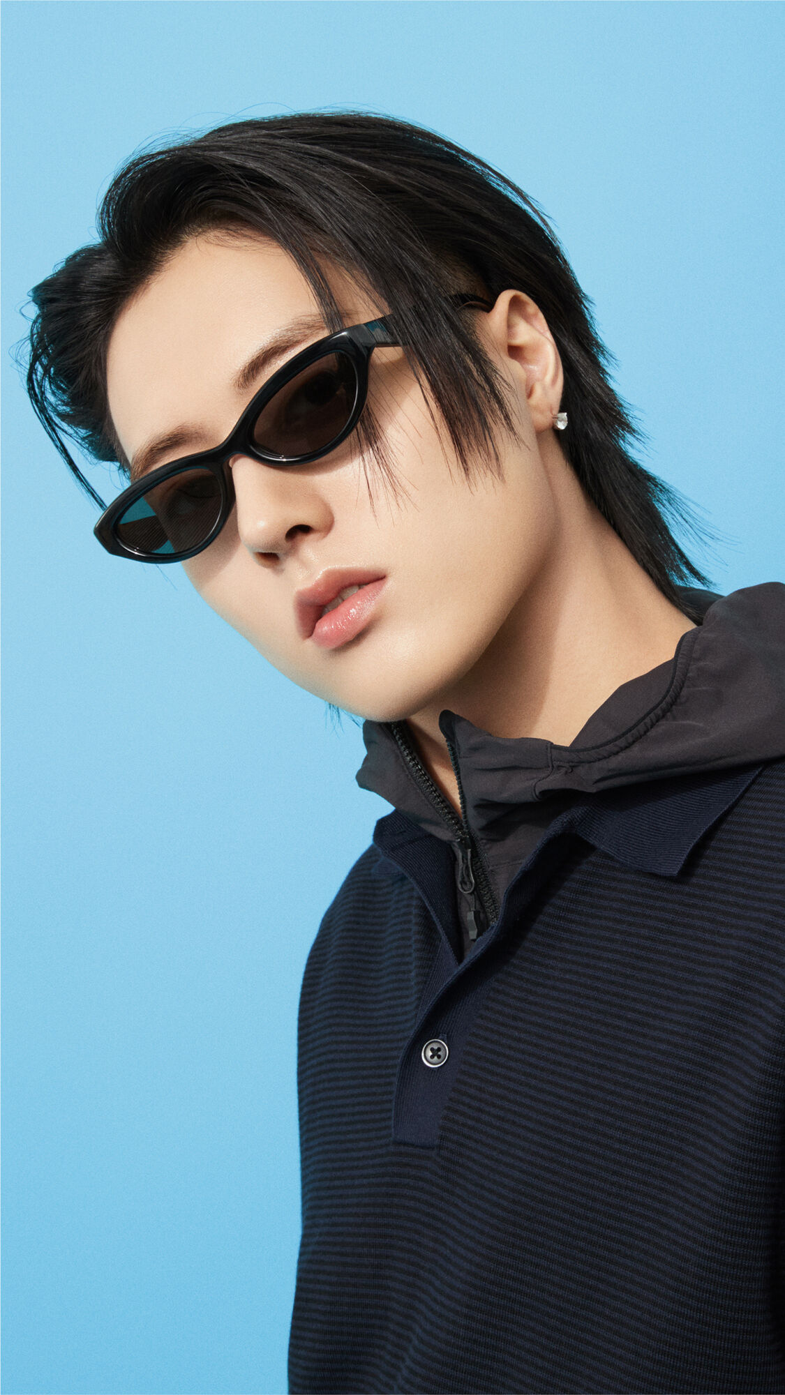 A close-up image emphasizing HARUTOs features as he gazes forward with a sharp look while wearing stylish Narrow Sunglasses.