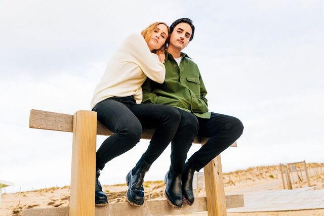 couple sitting outside wearing UNIQLO jeans