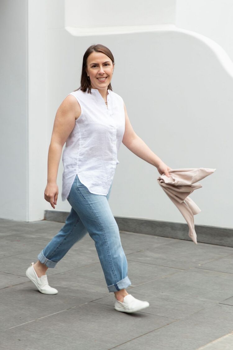 woman wearing UNIQLO white sleeveless shirt and jeans