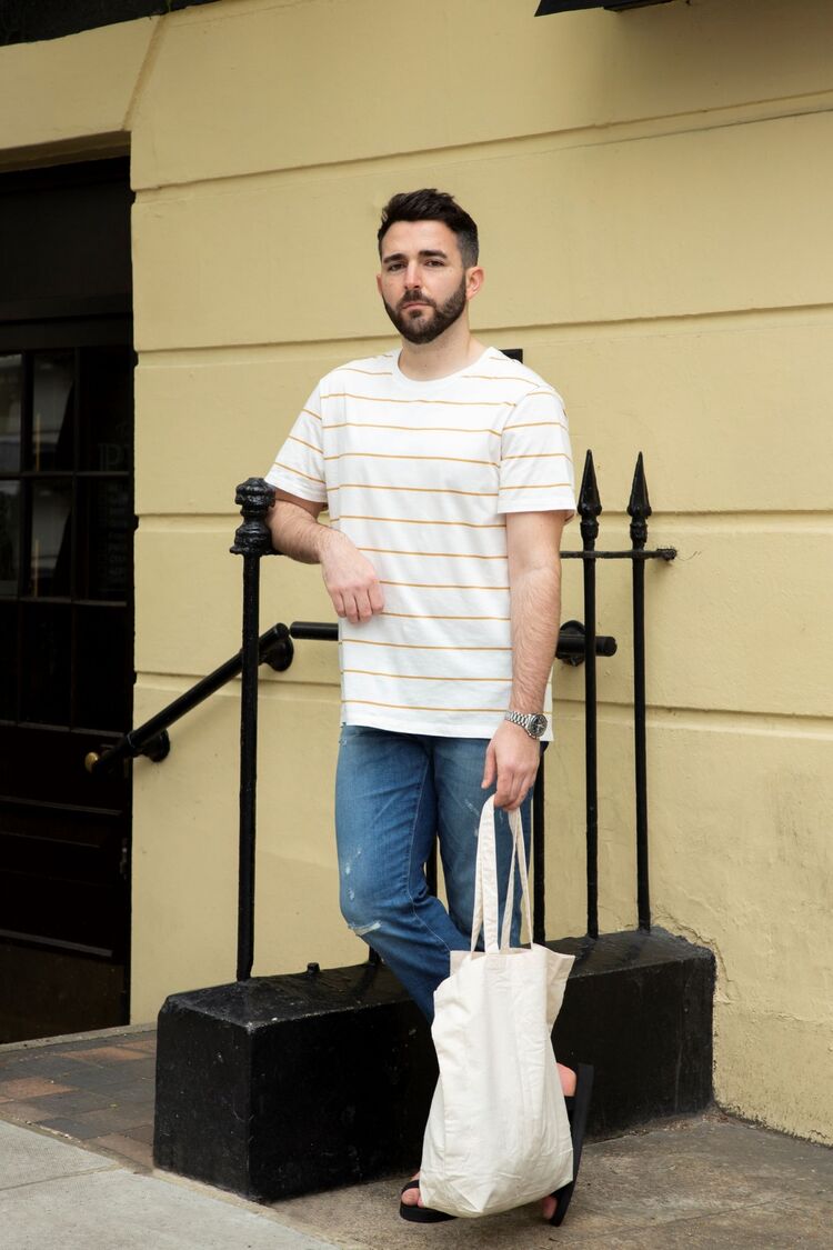 man wearing UNIQLO striped T-shirt and jeans