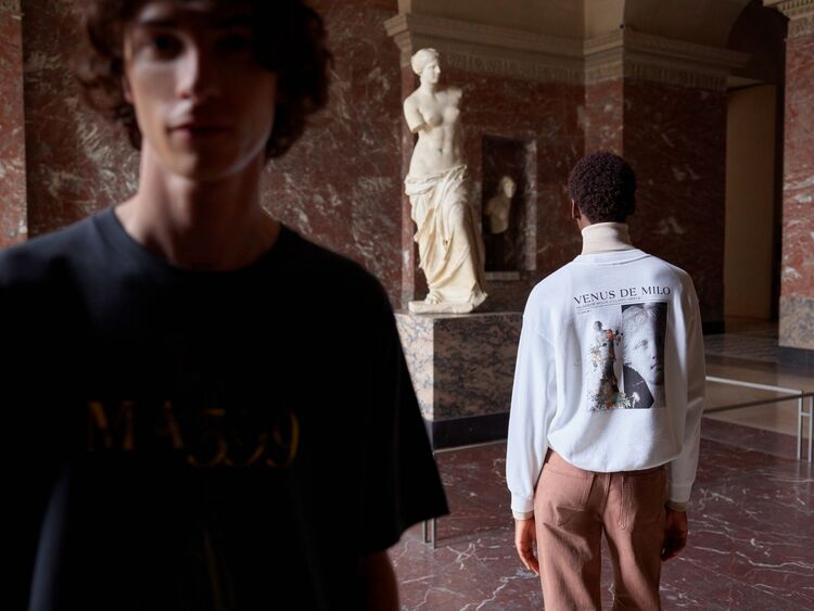Models wearing a uniqlo ut t-shirt and uniqlo ut sweatshirt