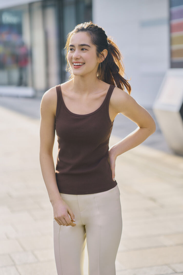 woman wearing UNIQLO AIRism Cotton Ribbed Sleeveless Bra Top and Easy Flared Trousers 