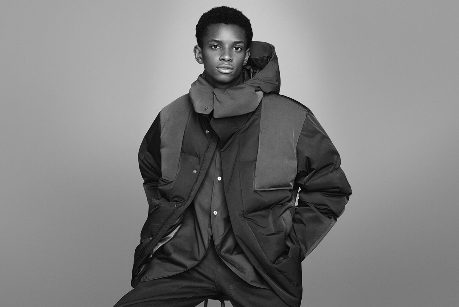 Man wearing a +J down oversized parka