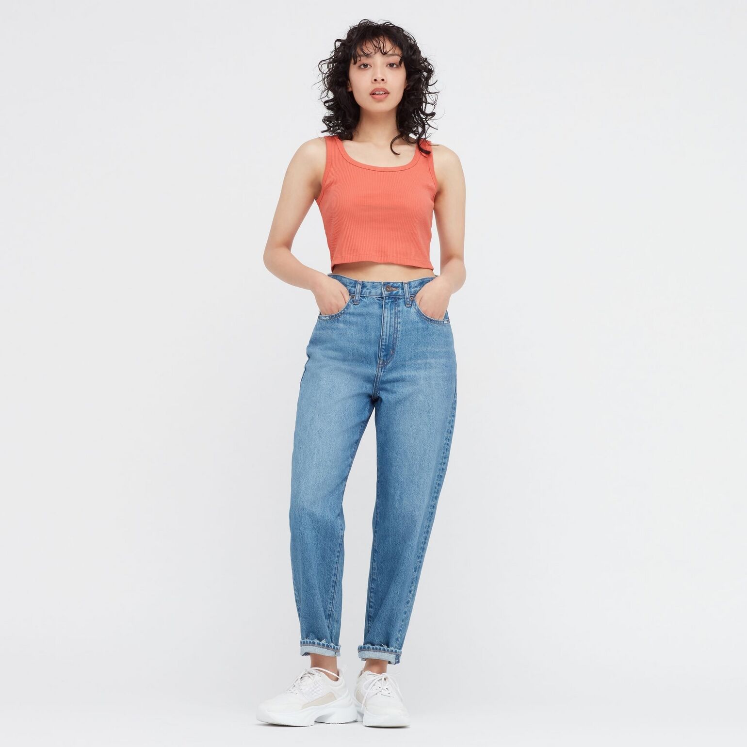 woman wearing UNIQLO mom jeans with cropped top