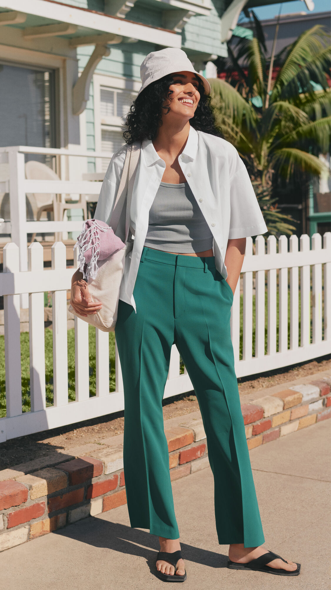 model wearing short sleeved shirt and trousers