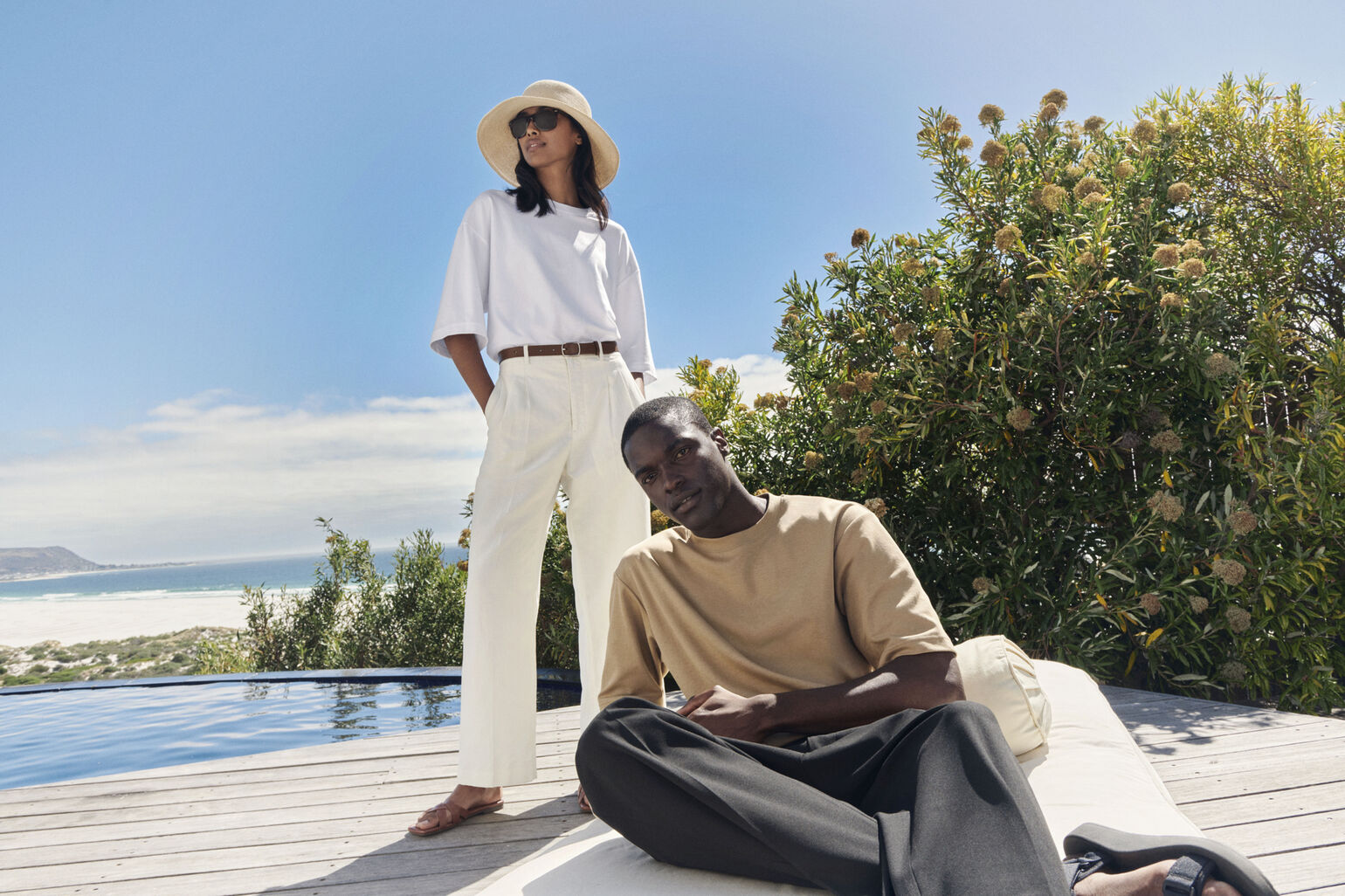 two models wearing the Uniqlo U AIRism cotton oversized T-shirt