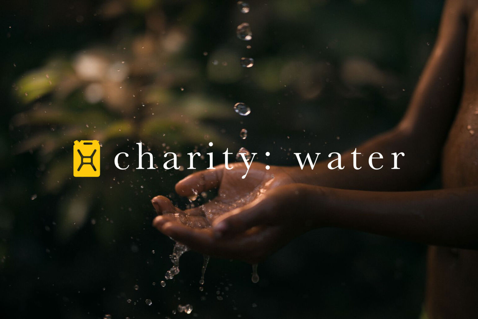 charity : water asset showing hands cupping water