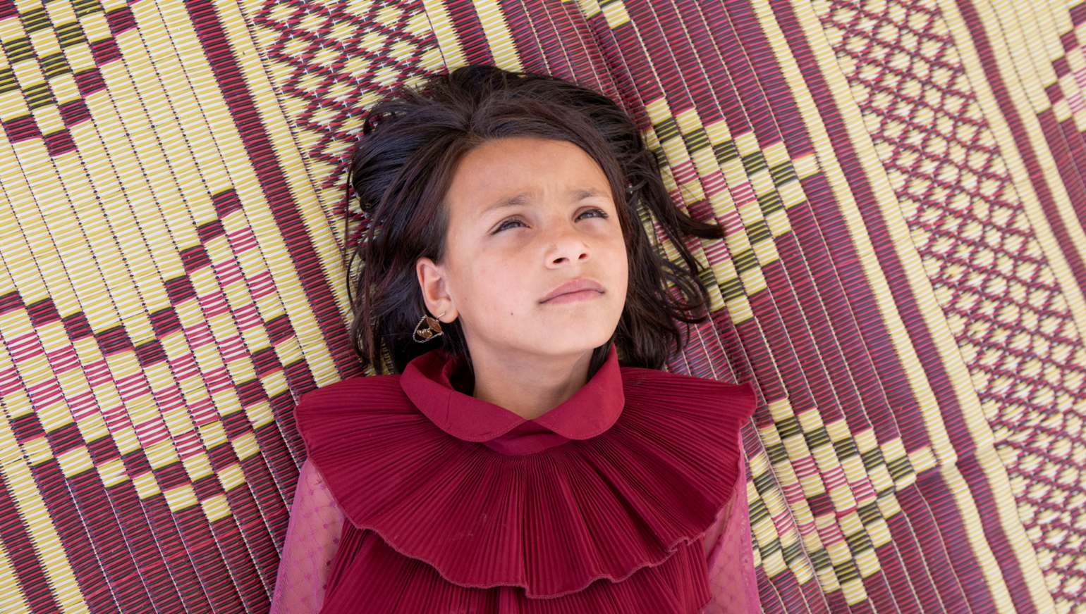 12-year-old girl, daydreaming at a Girls Empowerment Centre, run by Save the Children, in Jordan