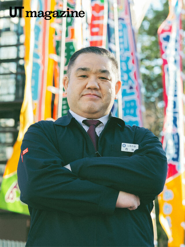 Man wearing a jacket over a button up shirt and tie, with crossed arms