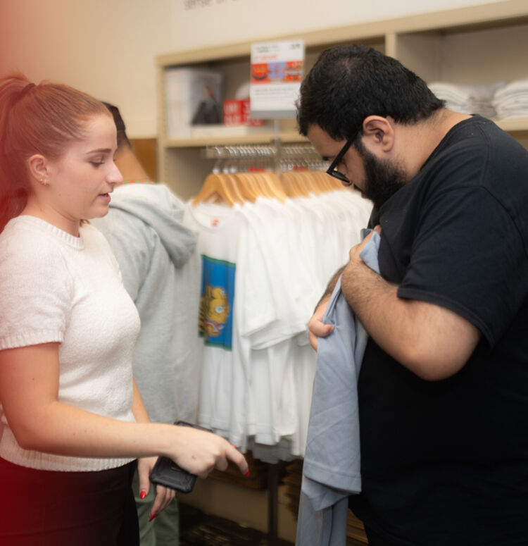 Person folding clothing