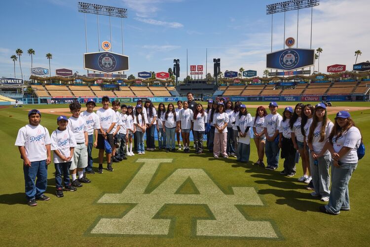 Group photo of participants in the UNIQLO Field at Dodger Stadium Academy