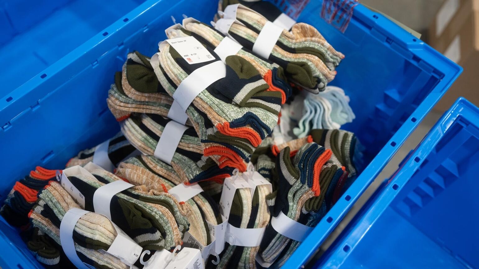 Image of donated socks in a bin