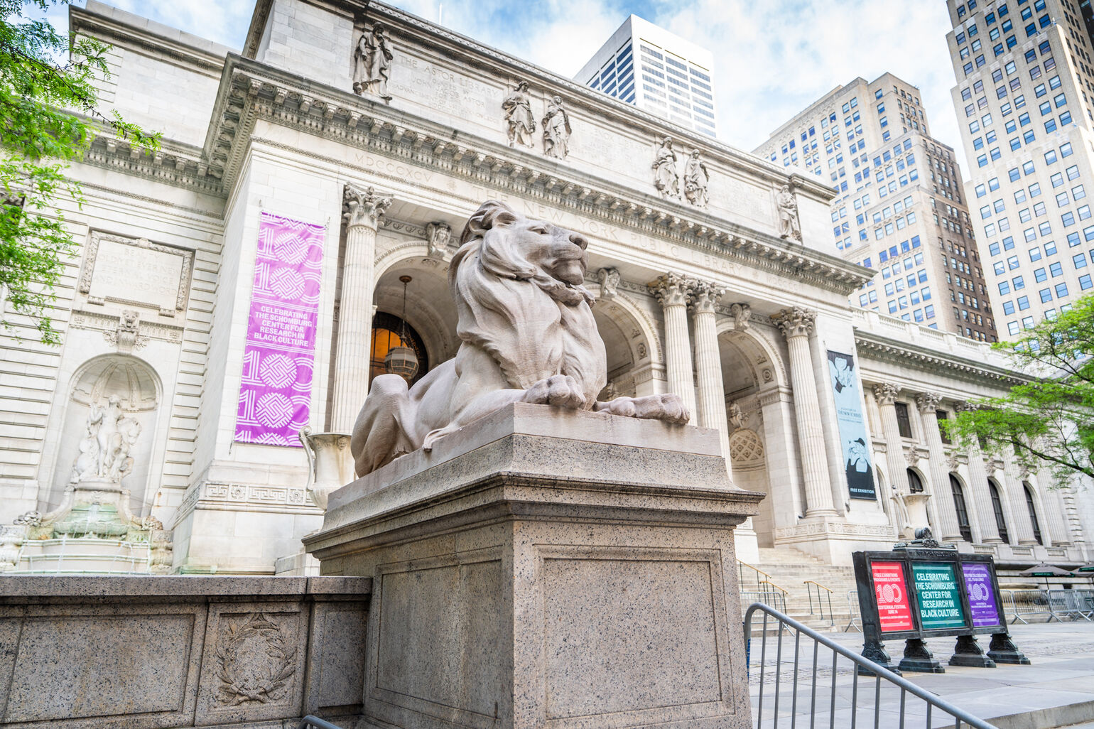 New York Public Library entrance with the left marble lion in the center