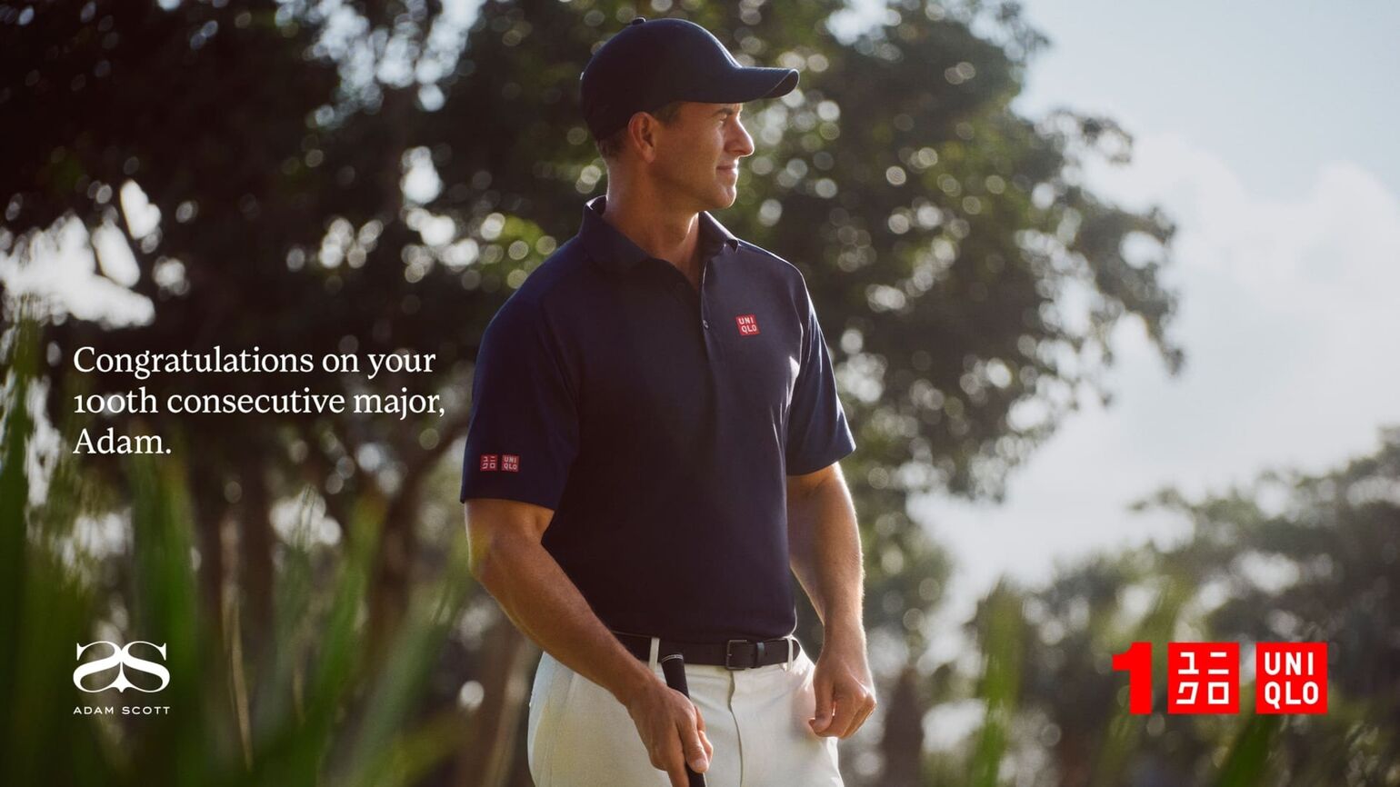 Adam Scott wearing the navy Adam Scott polo shirt with the UNIQLO Logo