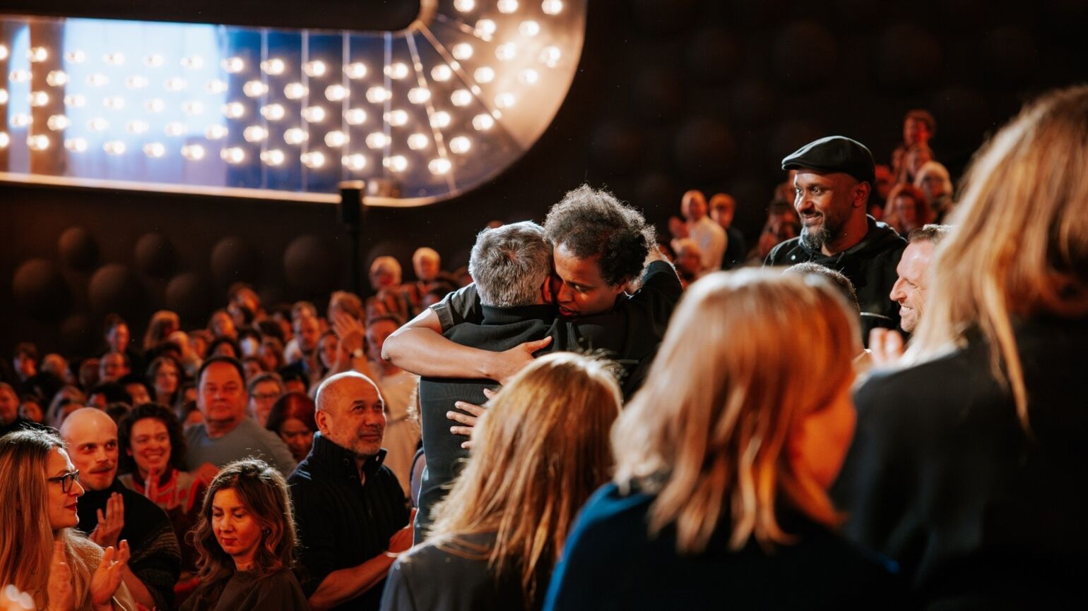 A powerful moment after the premiere as directors Mohammad Rasoulof and Mo Harawe stand up in the audience and share a warm embrace.